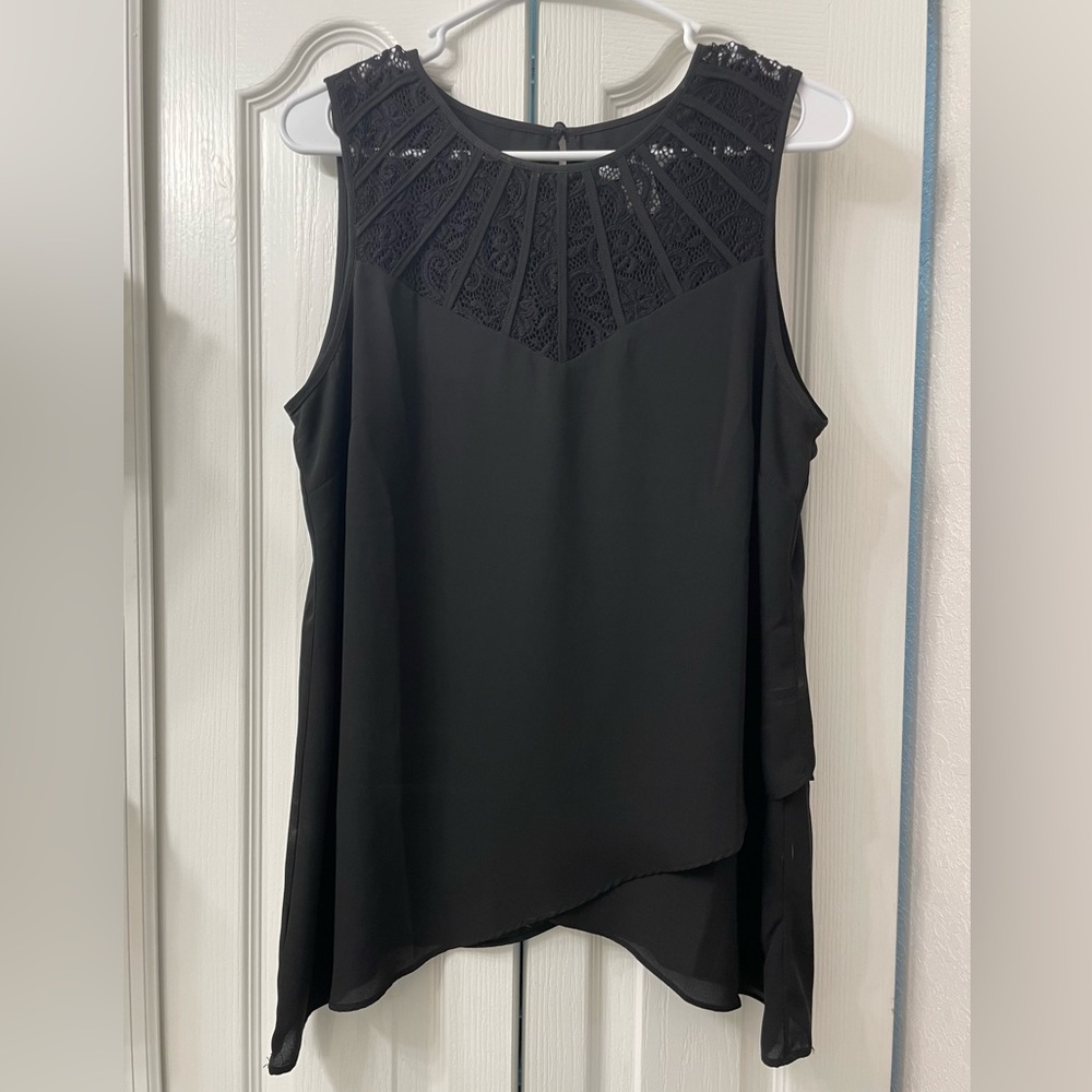 Black top with lace details. Never been worn